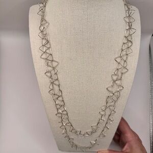 Scandinavian inspired 48" silver triangle link chain necklace.